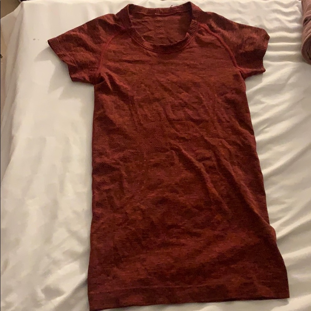 red lululemon tight shirt